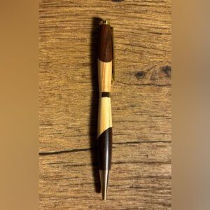 Beautiful hand turned wood ink pen. Smooth writing black ink. Gold accents.